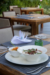 Classic beef stew with cream sauce and dill served with white rice aside	