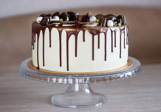 holiday cake with chocolate on a table on a light background