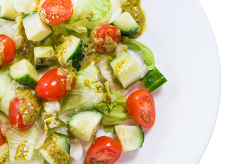 Fresh vegetable salad with pesto sauce