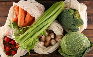 eco natural bags with vegetables, eco friendly, flat lay. sustainable lifestyle concept. zero waste vegetables shopping. plastic free items. reuse, reduce, recycle, refuse