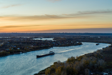 Barge on the river at sunset, beautiful landscape, aerial view