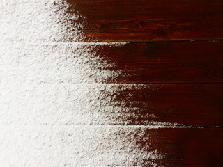Snow on the red wooden floor. Winter background