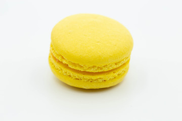 sweet yellow macaron isolated on white background