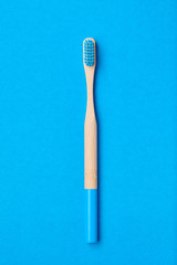 Toothbrush on blue background top view