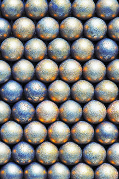 The surface of the many balls of light yellow and blue. Abstract festive background or wallpaper. View from above. Vertical shot. Macro