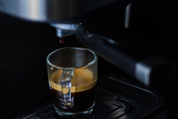 Espresso coffee from a drip-glass coffee machine.
