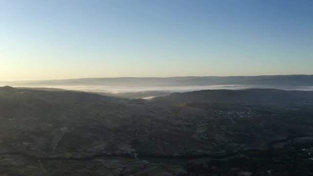 Mist on the mountains. Beautiful landscape aerial view shot on sunrise .