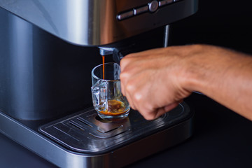 Espresso coffee from a drip-glass coffee machine.