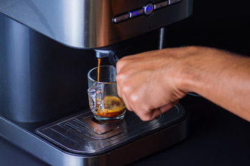 Espresso coffee from a drip-glass coffee machine.