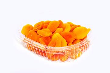 Dried apricots close-up on a white background.
