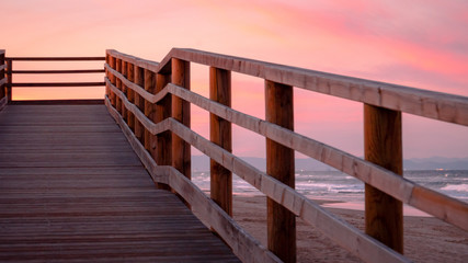 Wild beach with sandy dunes at sunset by the Mediterranean Sea in Valencia Spain