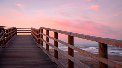 Obraz premium Wild beach with sandy dunes at sunset by the Mediterranean Sea in Valencia Spain
