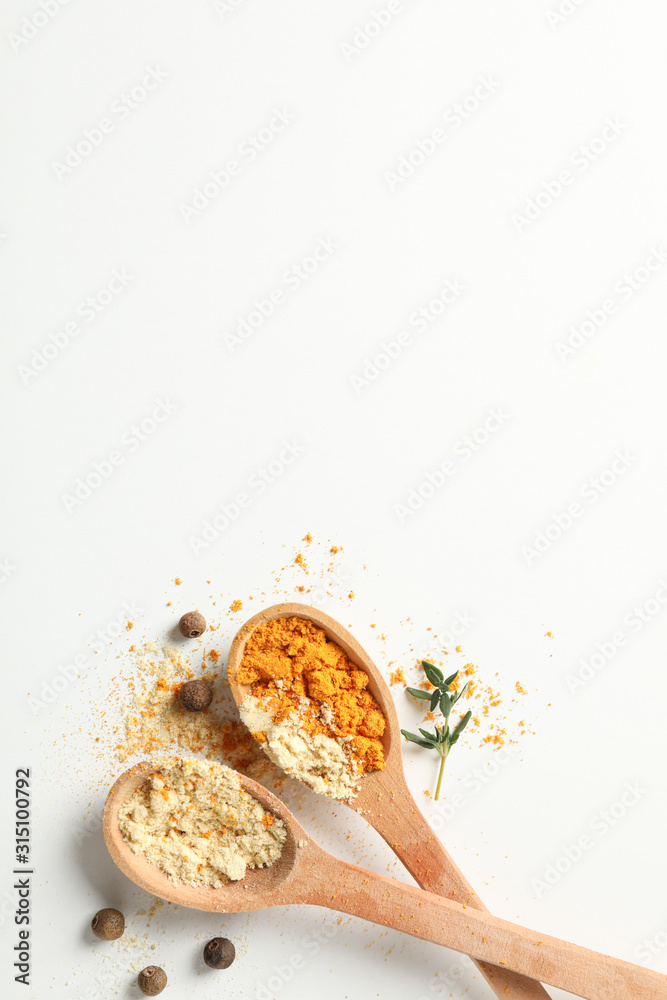 Sticker Spoons with turmeric and ginger powder on white background, space for text