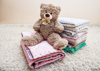 blankets and teddy bear