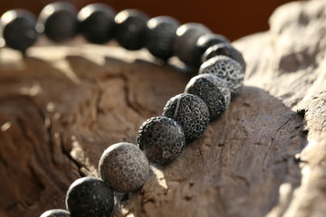 Natural gemstones - Dragon Veins Agate beads close up on old wood