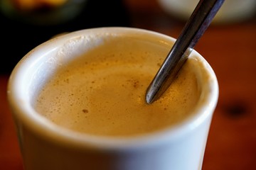 Hot Mug of Cappuccino on a Wood Bar