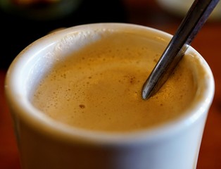 Hot Mug of Cappuccino on a Wood Bar