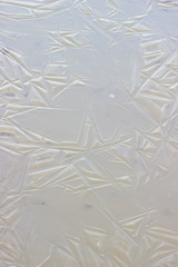 texture of thin ice on a frozen river
