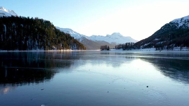 winter iced lake skating on ice - aerial view - St Moritz in winter