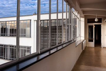 Germany, Saxony-Anhalt, Dessau-Rosslau: Bauhaus building interior view with hallway, famous glass...