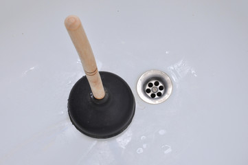 Plunger and clogged bath.
