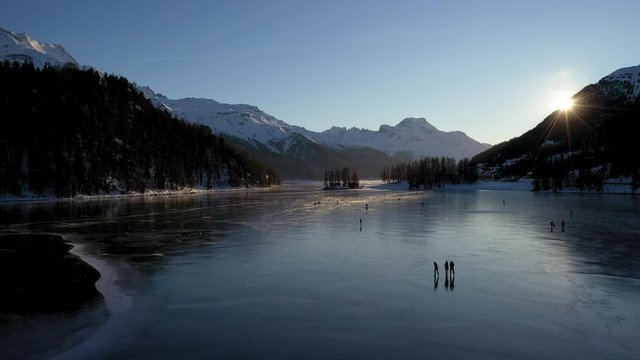 winter iced lake skating on ice - aerial view - St Moritz in winter