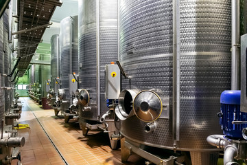 Metal silos for the fermentation of wine after pressing the grapes.