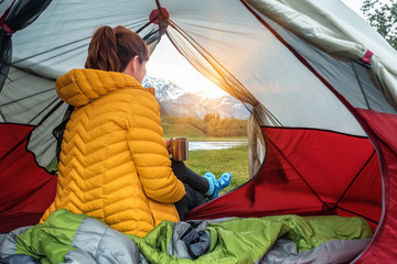 yellow down jacket in he tent