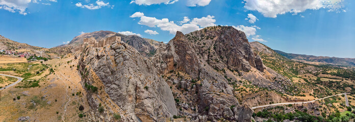 Aerial view of Kahta Castle, Kalesi. The Yeni Kale Fortress in Eski Kahta is perched atop a hill with a steep slope. Walls of the manor surround the entire hill. Very close to Mount Nemrut. Anatolia. 