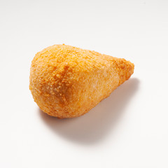 Coxinha is a popular food in Brazil consisting of chopped or shredded chicken meat, covered in dough, molded into a shape resembling a teardrop, battered and fried.