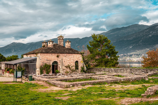 View of an old building in the Acropolis of Its Kale, the Ottoman castle in Ioannina, Greece. Lake Pamvotis is on the background.