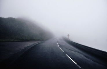 Fog on the road in the mountains. Sao Miguel Island, Azores.