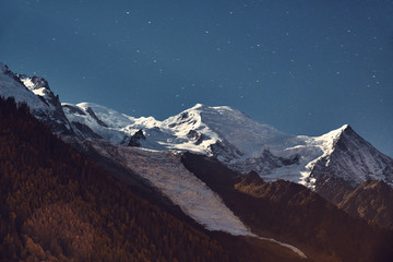 View from Chamonix to the Mont Blanc massif at night. Alps, France. Mountain landscape.