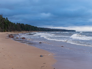 beautiful seascape, dark clouds and white waves