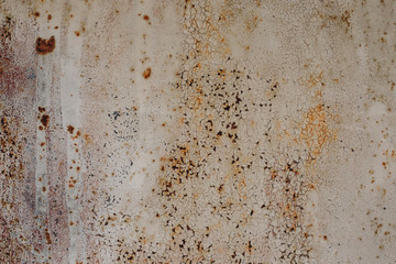 Grunge aged metal background with peeled off blue gray paint and rusty surface