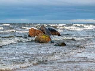 beautiful seascape, dark clouds and white waves