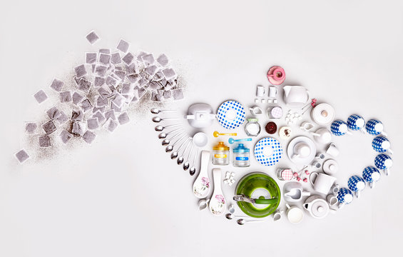 Still life concept tea utensils forming steaming teapot