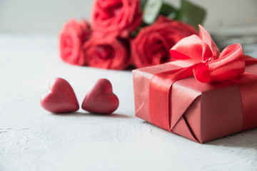 Valentines day greeting card with romantic gift, red roses, sweets. Space for text.