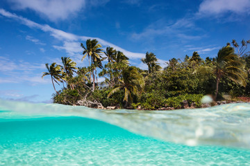 Tropical island beach beyond ocean surface, Vava'u, Tonga, Pacific Ocean