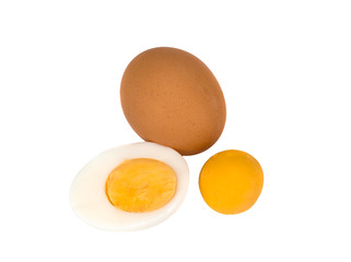 the egg, its half and a yolk isolated on a white background