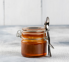 Homemade salted caramel sauce. Selective focus, space for text.