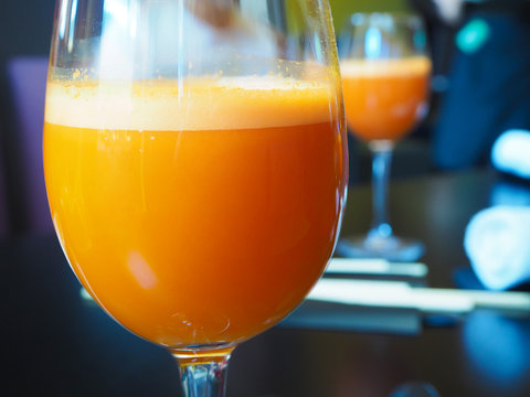 A glass of healthy carrot juice on the table