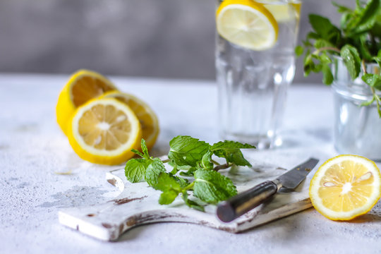 Photo of fresh cool lemon mint water. Infused water. Cocktail. Detox drink. Health care. Fitness. Summer drink. Still life photography. Image.