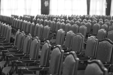 Empty chairs in the concert hall․ black and white photo