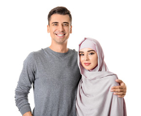 Portrait of Muslim couple on white background