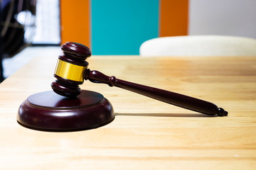 The hammer is a symbol of the judge.