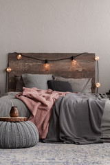 Trendy rustic bedroom design with grey and paste pink bedding