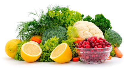 Fresh vegetables and bowl with cranberries isolated.