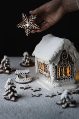Gingerbread cookie house decorated with white glaze