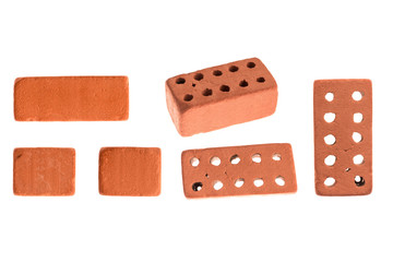 Decorative, facing, ceramic, red, used in construction brick with holes under different focus and in section. Isolated on a white background